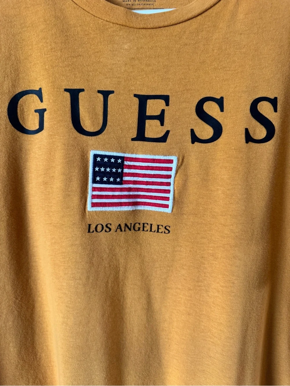 GUESS Men’s Mustard Orange Logo Tee with Flag Patch - Picture 2 of 4